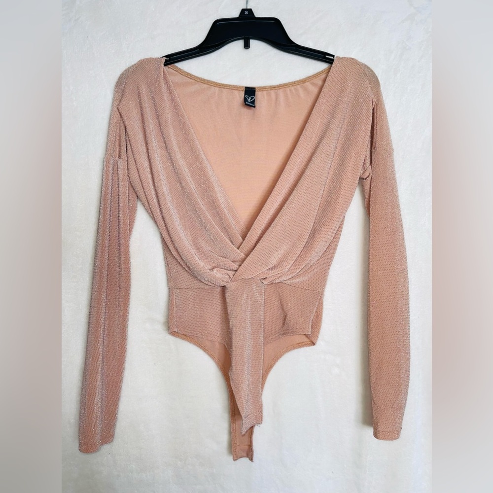size Small bodysuit. Sparkly but nice and soft on the inside. Never worn.